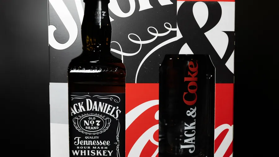 Jack Daniel's Old No. 7 paired with a custom Coke 'can glass' in a vibrant collector's box.