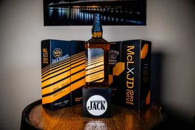 2024 Jack Daniel's x McLaren collaboration bottle from the side with '24 and '23 boxes in background