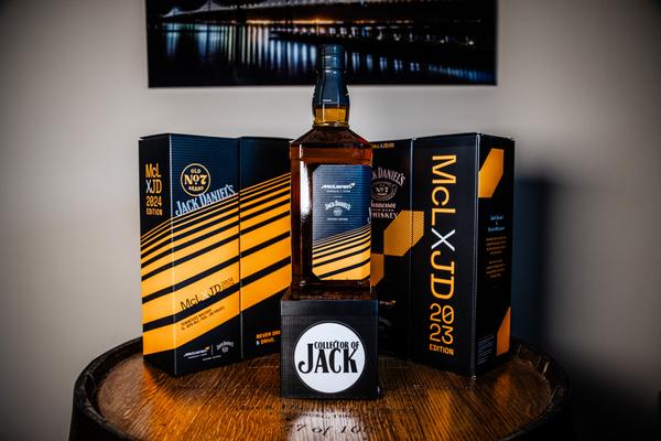 2024 Jack Daniel's x McLaren collaboration bottle from the side with '24 and '23 boxes in background